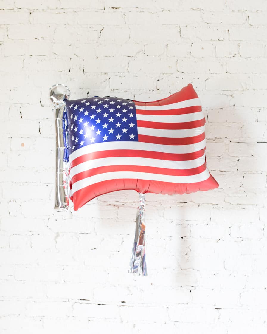 27in Flag Foil Balloon and Silver Skirt | Rental